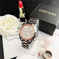 Contena watch with rose gold face and silver band on a surface with a flower, lipstick, and Contena box.